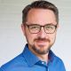 Tapio Liller with beard and blue shirt
